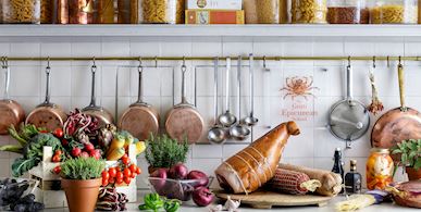 Kitchen area with study and display cases of wine